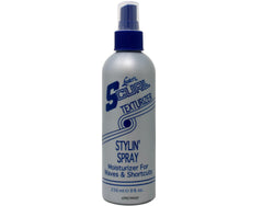 Aplicación de Luster's S-Curl en cabello húmedo para peinado rápido y control del encrespamiento.
