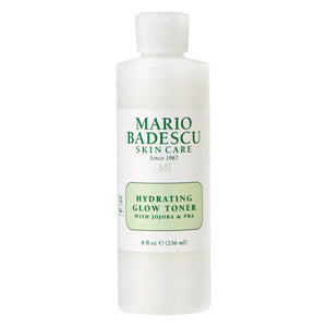 Tónico iluminador hidratante de Mario Badescu en botella, mejora luminosidad y hidratación.