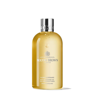 Molton Brown Flora Luminare, botella vertida, para una experiencia de ducha suave y aromática.