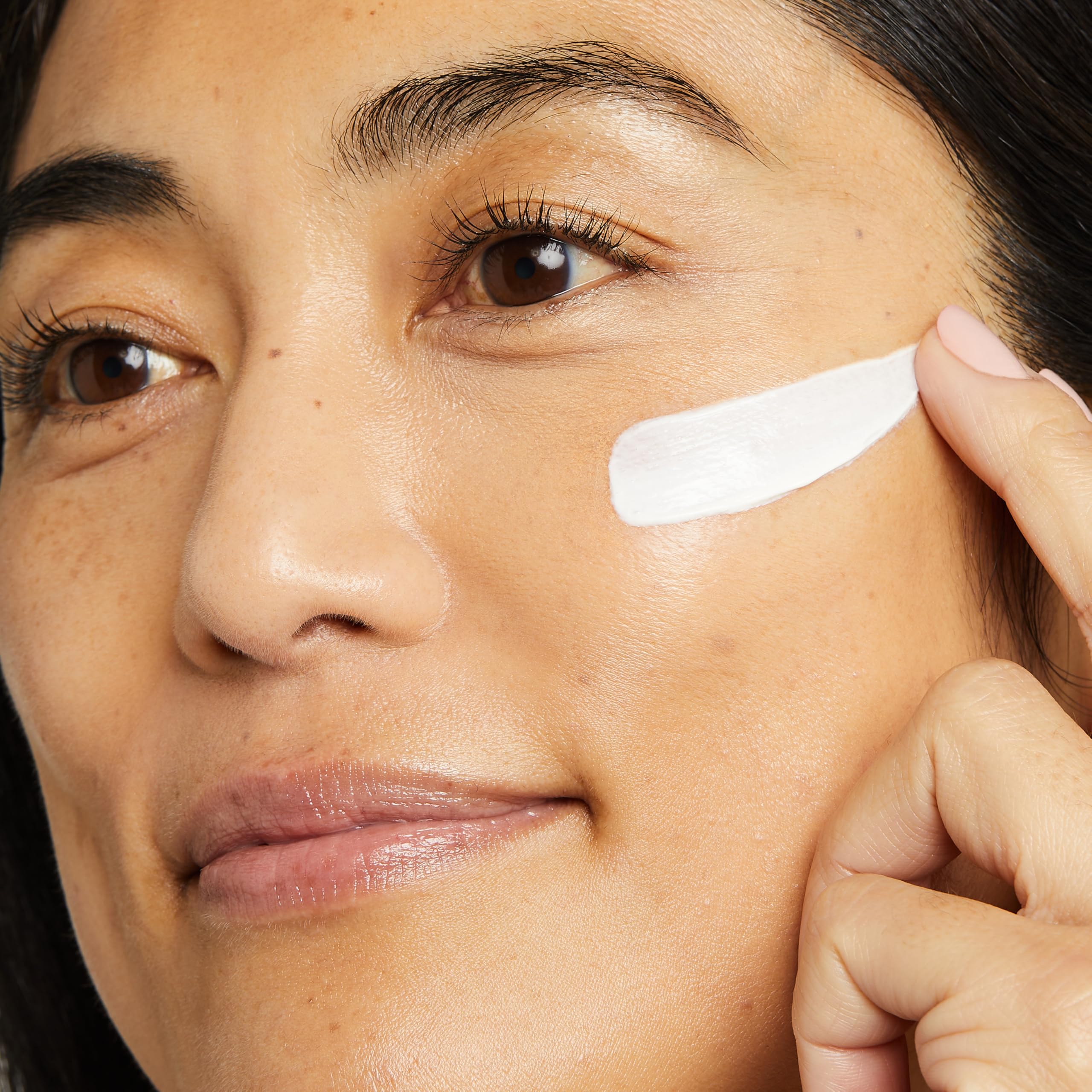 Texture close-up of No7 Restore & Renew cream showing rich, silky hydration