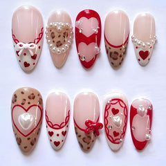 NZRAESTRS uñas valentinas leopard corazon perla lazo, ideal para un look romántico.