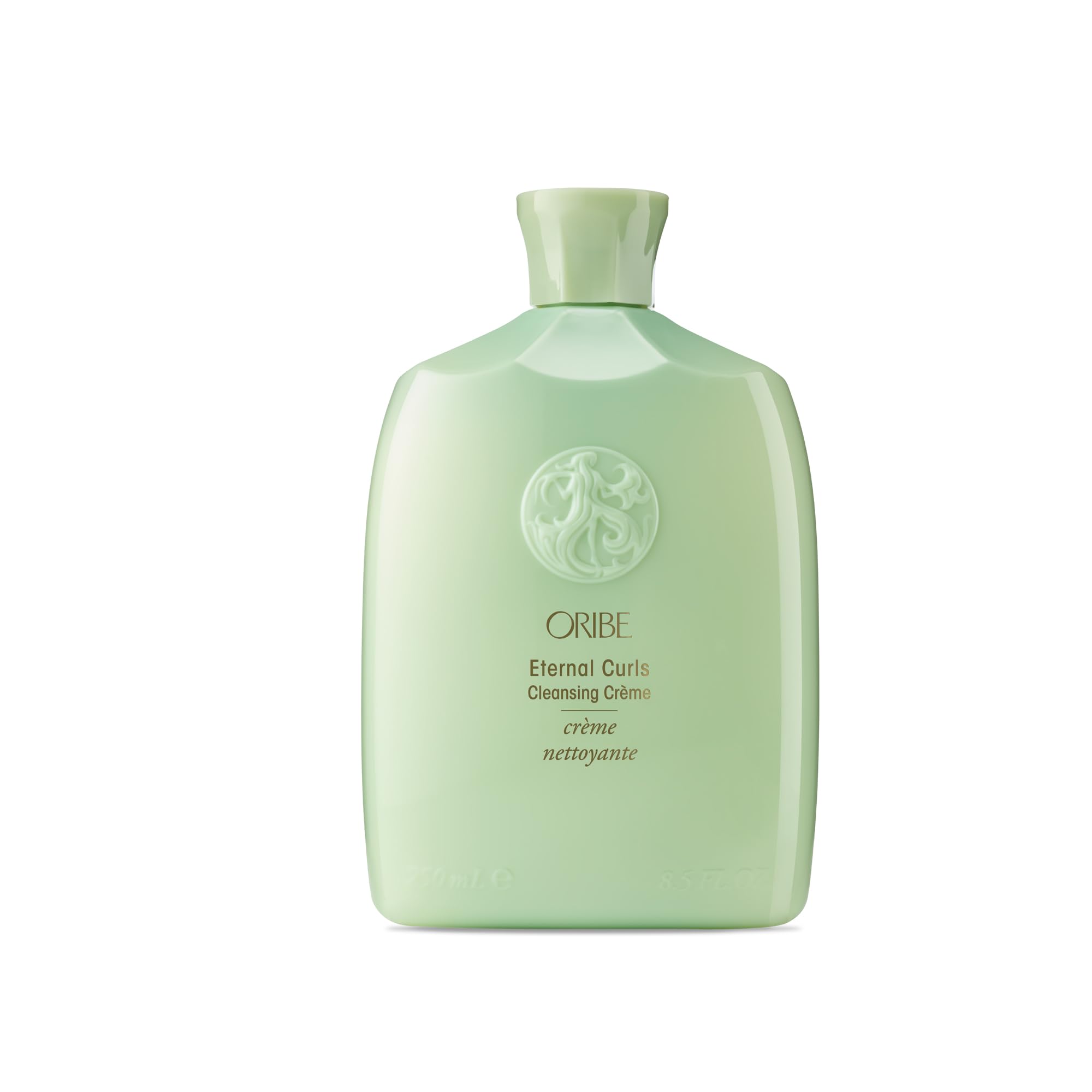 ORIBE Eternal Curls Cleansing Creme, botella elegante para limpieza suave sin espuma.