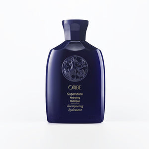 Oribe Supershine Champú de viaje: botella lista para llevar.