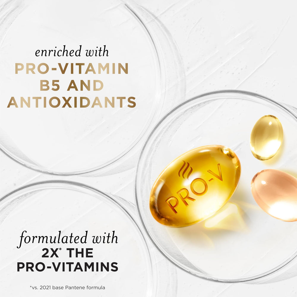 Hands massaging Pantene conditioner into hair for even coverage.