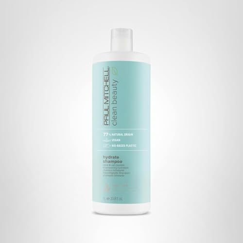 Botella de Hydrate Shampoo en baño, enfatizando sostenibilidad del envase.