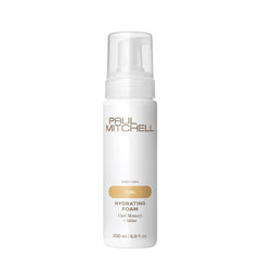 Espuma hidratante Paul Mitchell en botella para rizos definidos