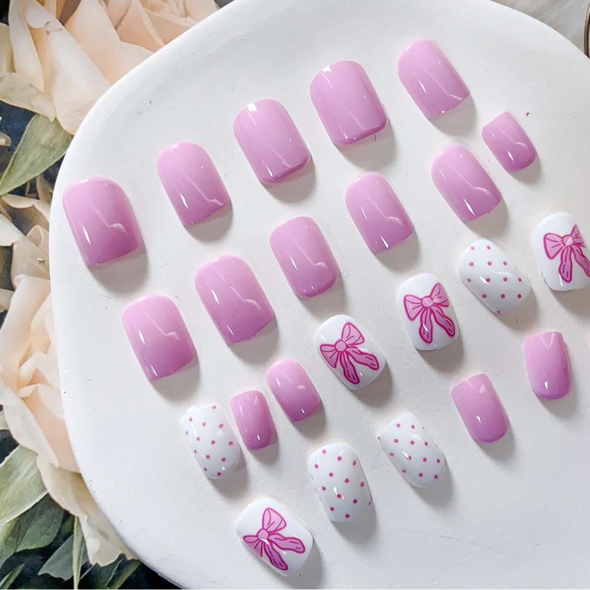 PowPop uñas rosa corto con lazo para uñas naturales.