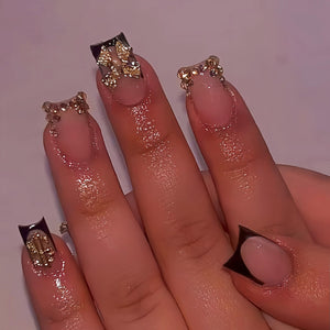 Quezadyl uñas frances negro con lazo dorado, estilo sofisticado para fiestas.