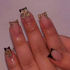 Quezadyl uñas frances negro con lazo dorado, estilo sofisticado para fiestas.