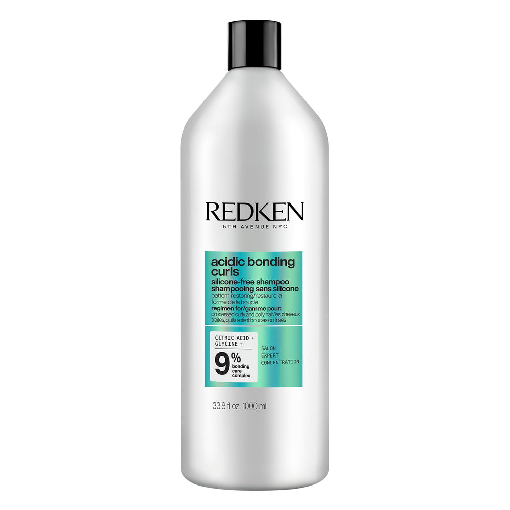 Redken Acidic Bonding Curls: botella elegante para limpieza suave de rizos.