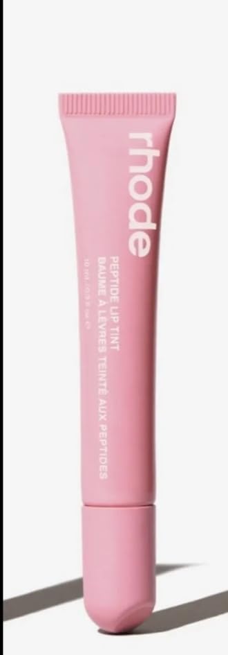 Rhode Lip Tint Ribbon Sheer Pink delivers hydrating color with peptide benefits for plumper-looking lips.