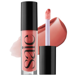 Saie Glossybounce en envase de vidrio con brillo sedoso para labios.