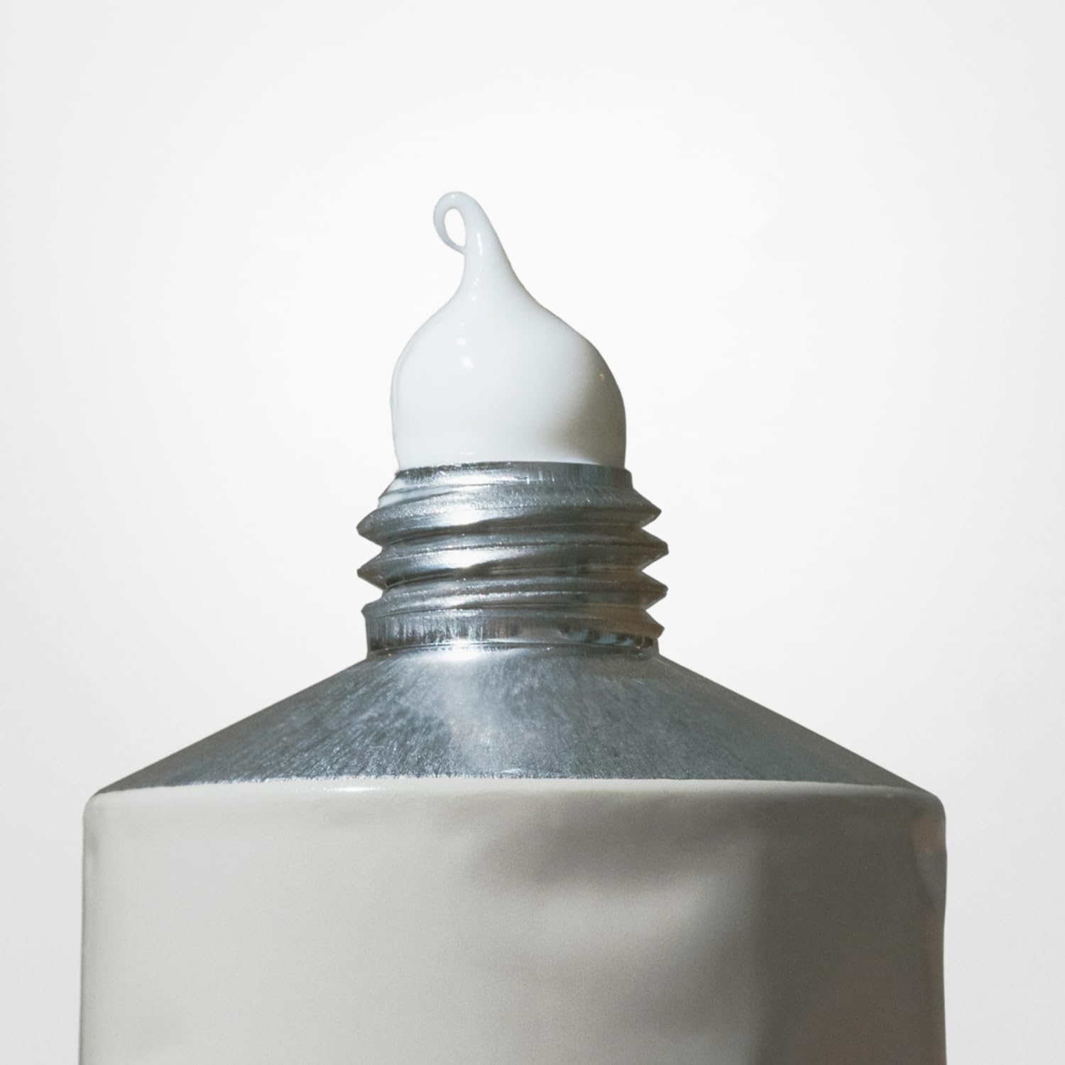 Salt & Stone Santal & Vetiver fragrance swirl suggesting warm daily use.