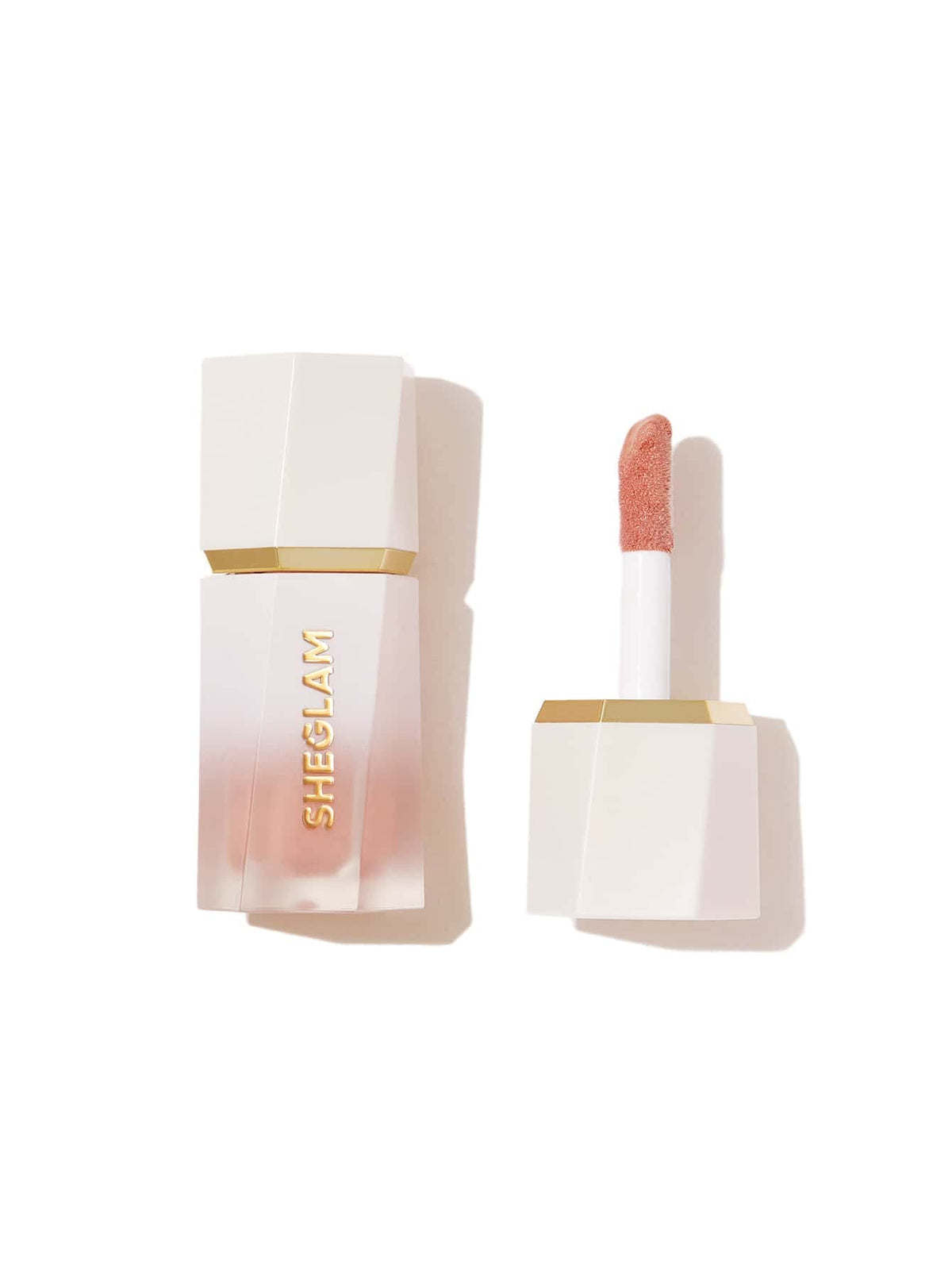 SHEGLAM Glow Bloom luminador líquido a prueba de agua en botella para durabilidad.