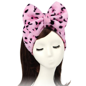 Diadema elástica Shintop con lazo rosa para fijar el pelo