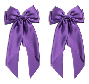 SUSULU lazo satinado grande morado en horquilla para peinados elegantes.