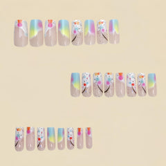 Uñas acrílicas brillantes gradiente rosa-azul de TBRZTR para un acabado deslumbrante.