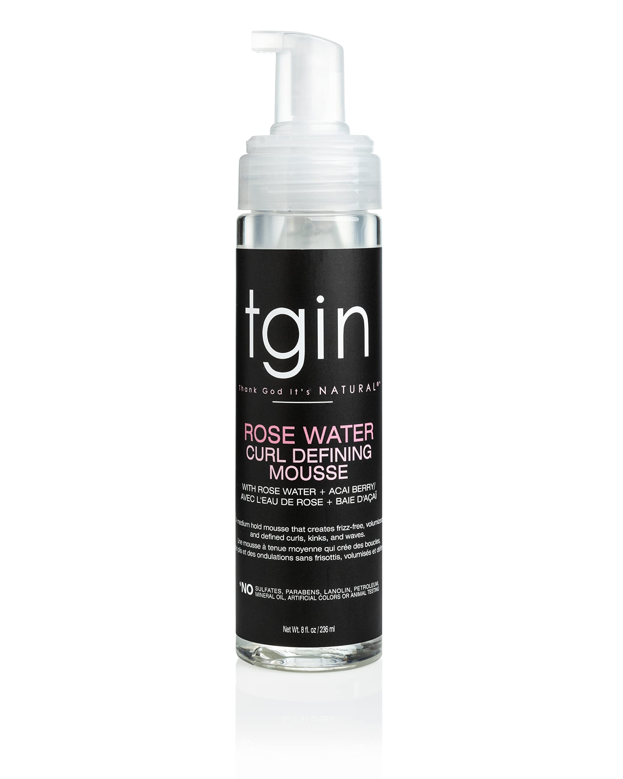 Mousse tgin para definición de rizos con agua de rosa en botella clara.