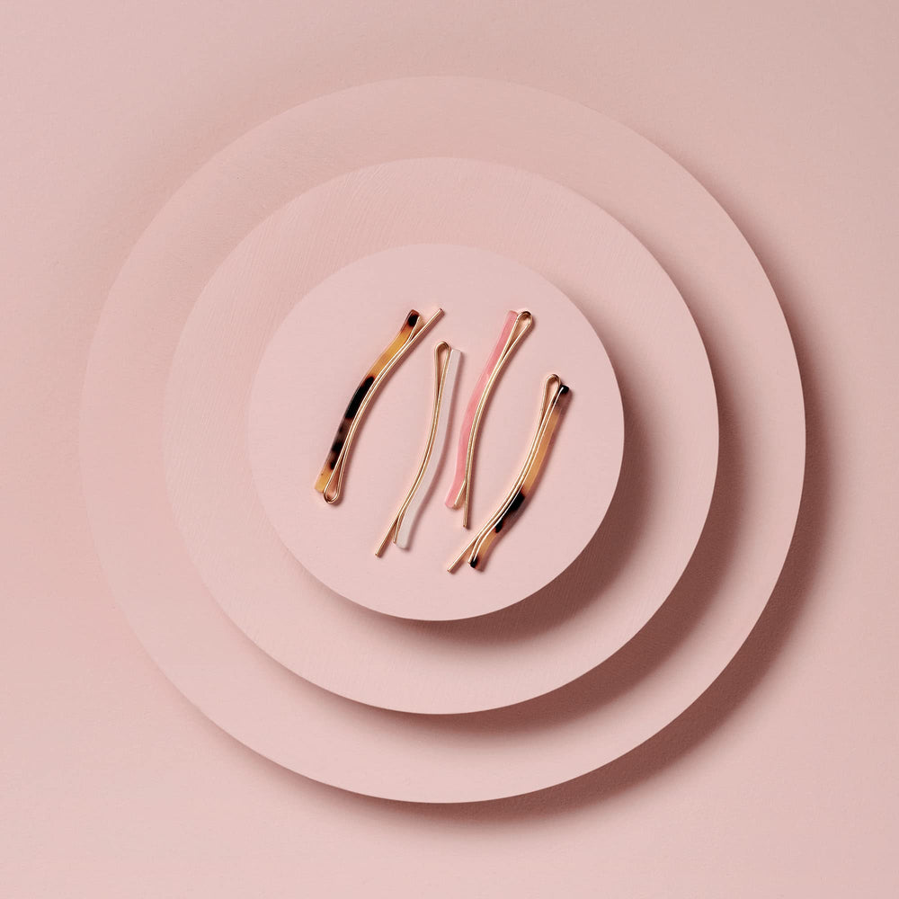 The Hair Edit Marble Pins acetato tortuga, aportan un toque chic a peinados.