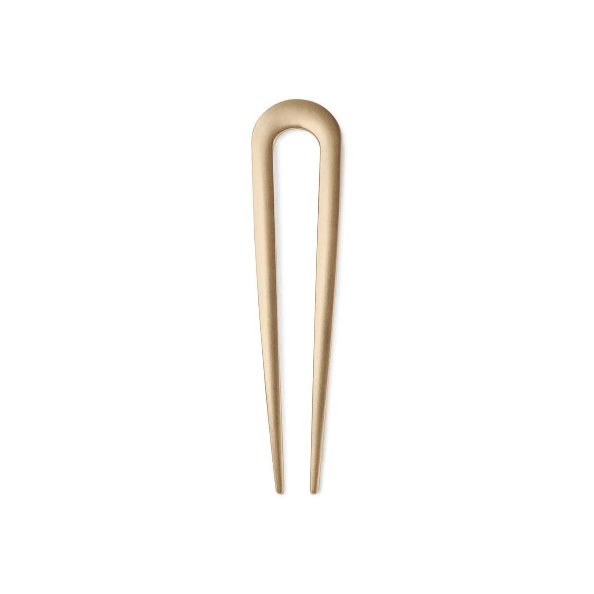 The Hair Edit Sleek Chignon Pin con acabado dorado suave para fijar peinados diarios con elegancia.