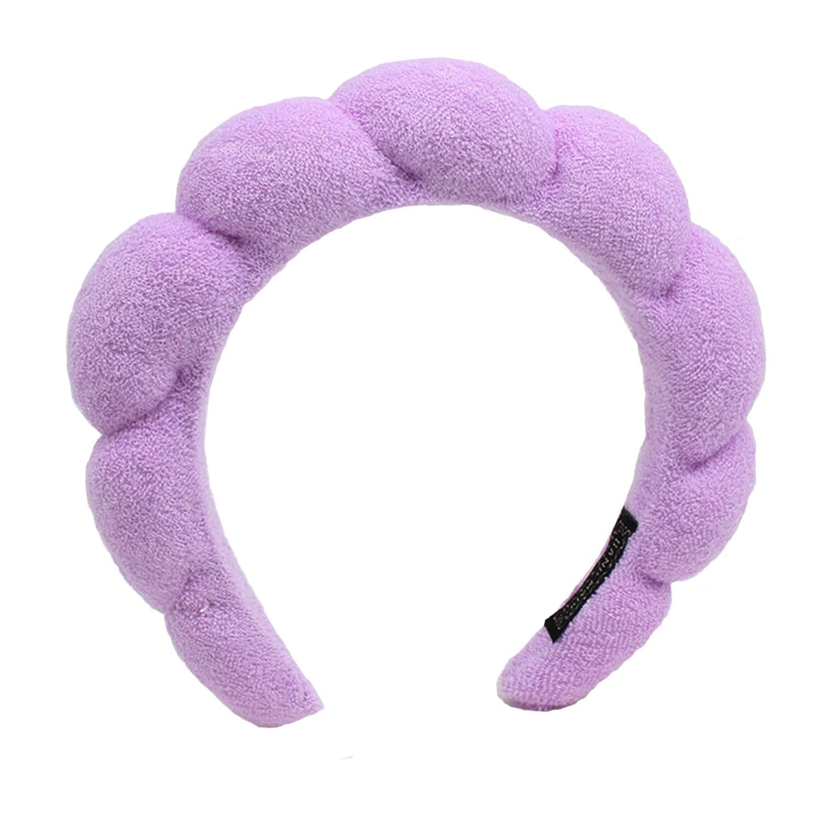 Diadema TYSSELY spa con flor protege el cabello durante el lavado facial.