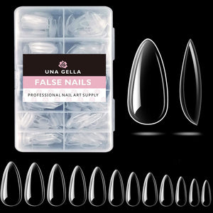 UNA GELLA tips almendra claros, extensión de uñas con acabado transparente.