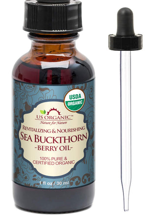 US Organic Aceite de espino amarillo en botella ámbar para uso facial y piel suave.
