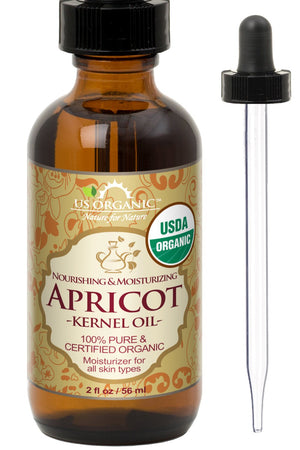 US Organic Aceite de albaricoque en botella ámbar conserva nutrientes y aroma suave.