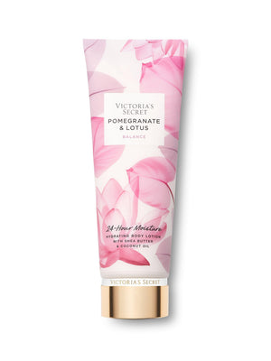 Botella de Victoria's Secret Pomegranate & Lotus, hidratante para piel suave.