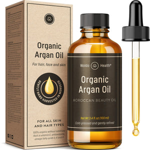 WoldoHealth aceite de argán prensado en frío en botella ámbar para cuidado diario.