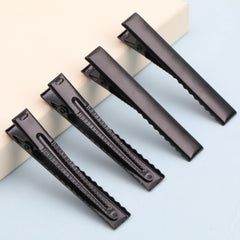 Pinza YAKA alligator negro con superficie satinada, acabado suave para el cabello