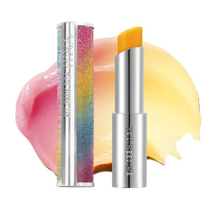 YNM bálsamo labial de miel arcoiris en envase para hidratación y acabado natural.