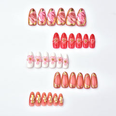 Uñas ZASKHLD con flor dorada, toque sofisticado para ocasiones.